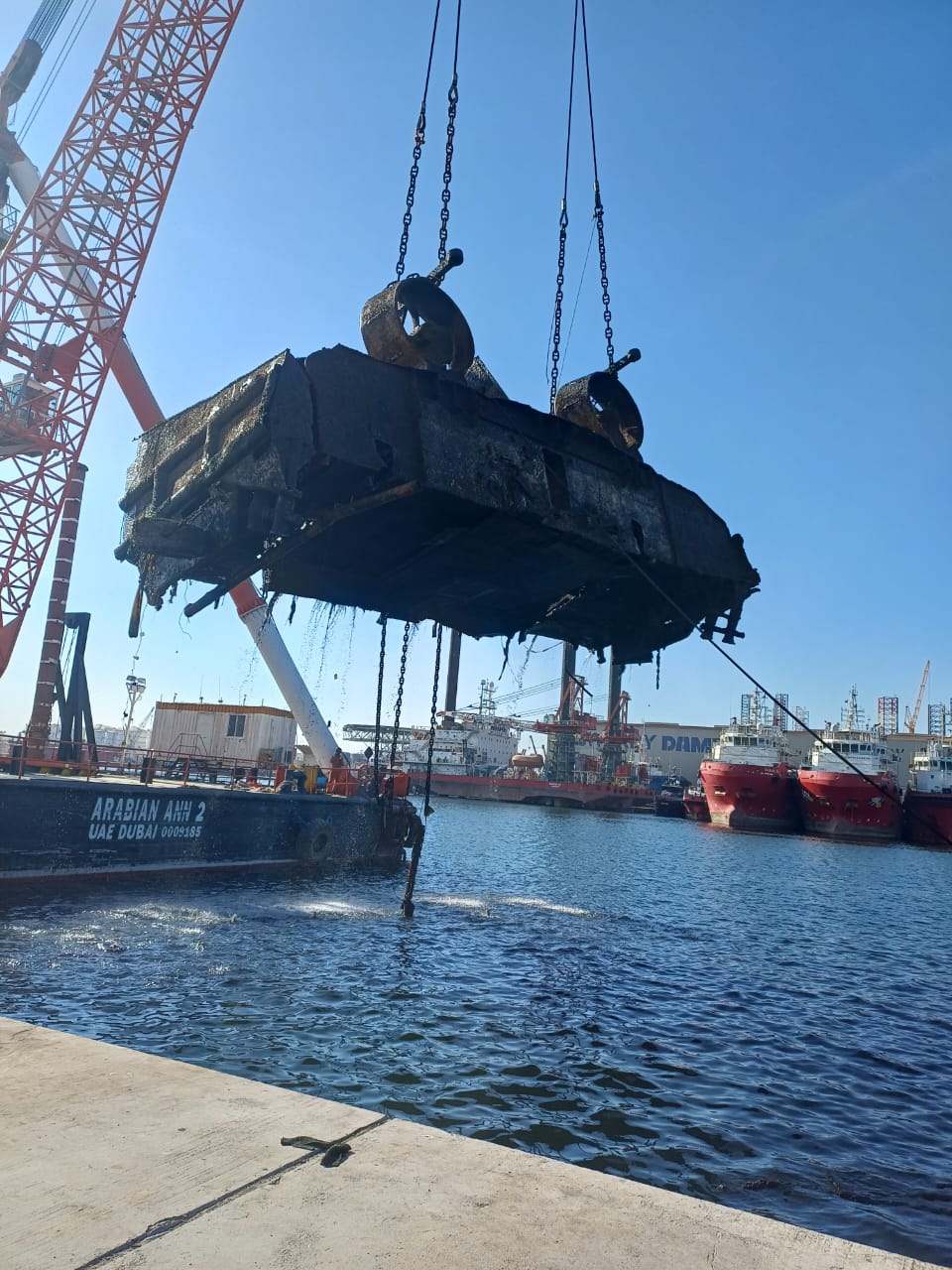 Recovered vessel hull suspended during Khalid Port wreck removal